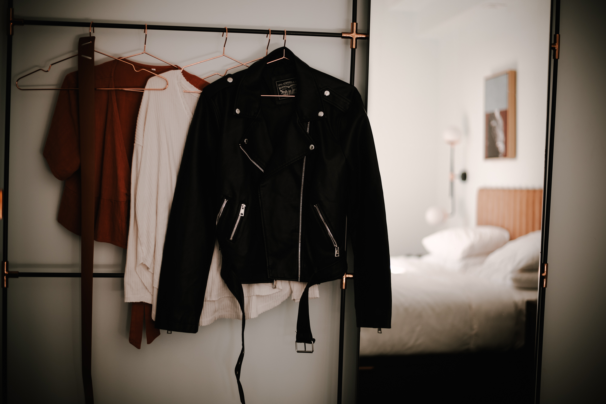 Brand photoshoot outfit options on clothing rack