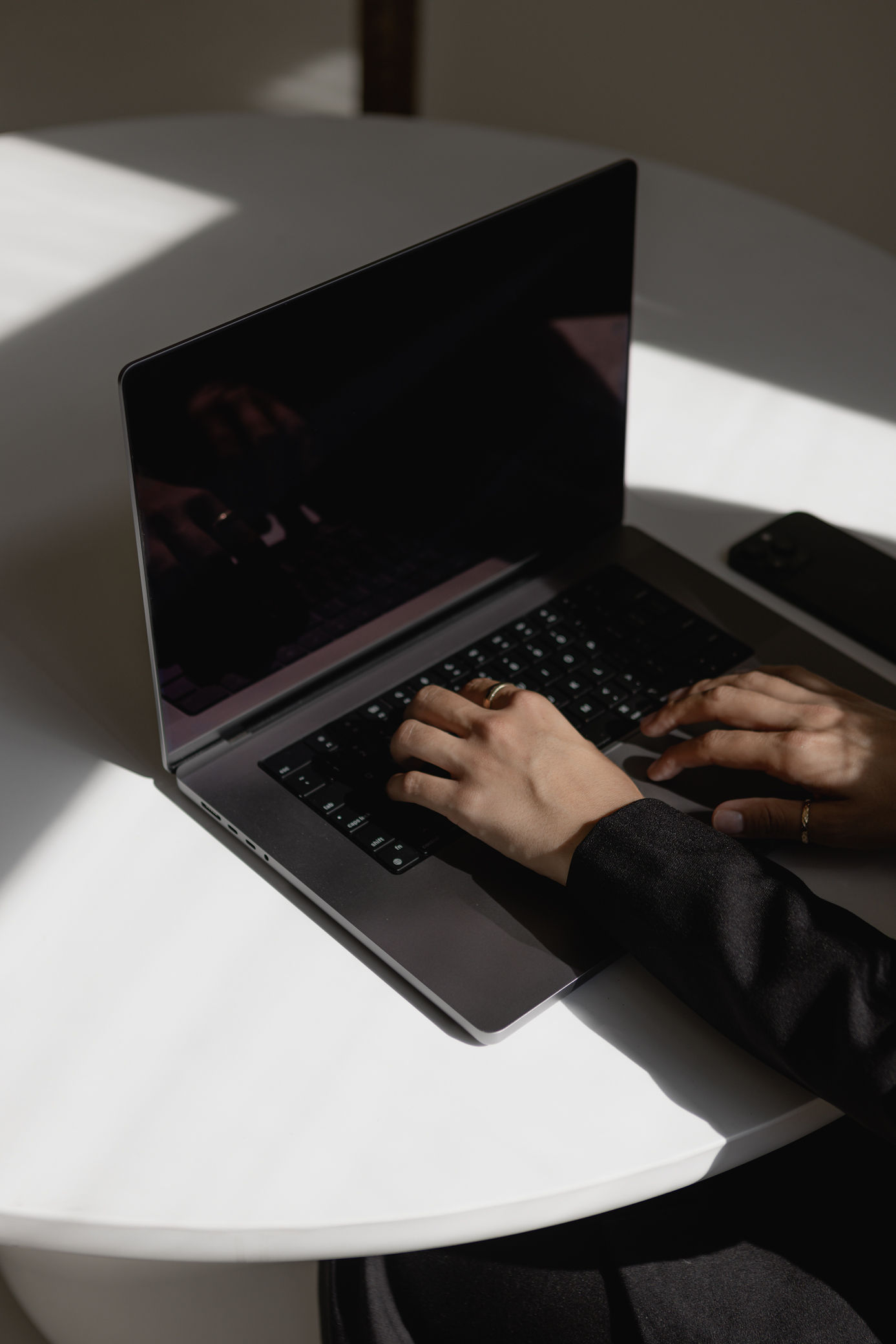 Website Designer working on a laptop focused on website strategy