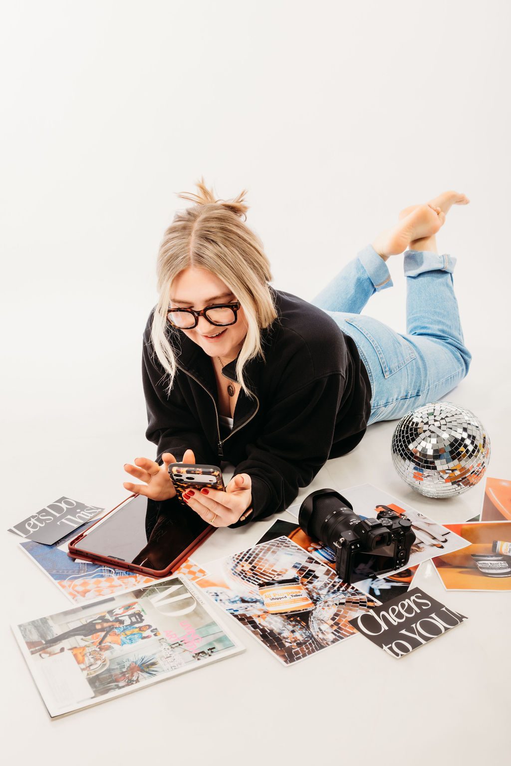 Amanda Livaudais looking at an iPad while reviewing a brand and website